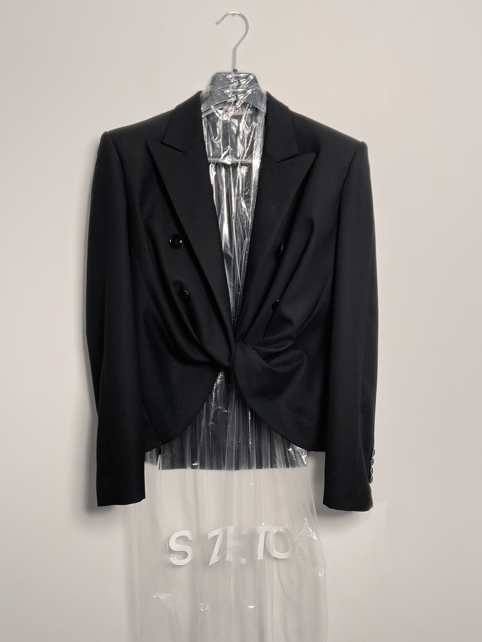 Ref. SWEATER JACKET- black pressed wool crepe twist jacket.